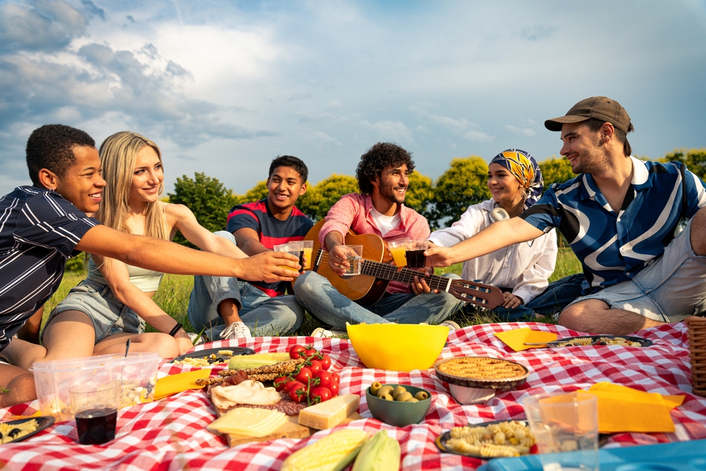 Multiethnic group of Generation Zs on a picnic.