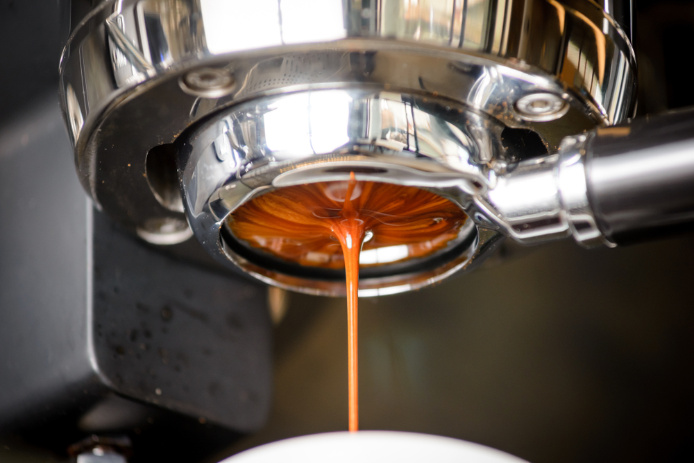 Close-up of espresso pouring from coffee machine