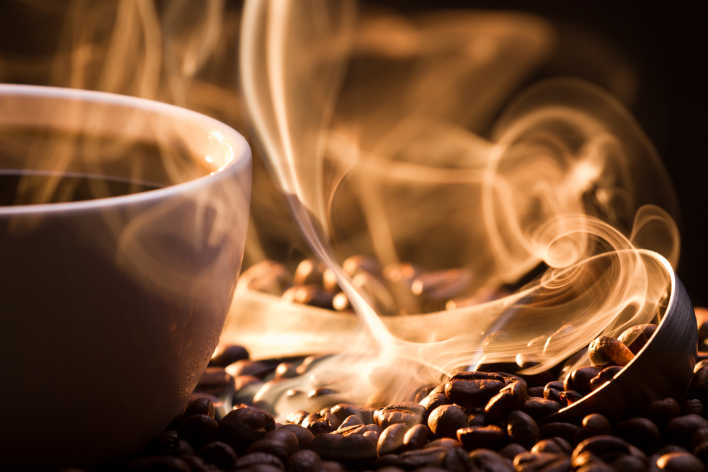 Coffee in cup and beans roasting