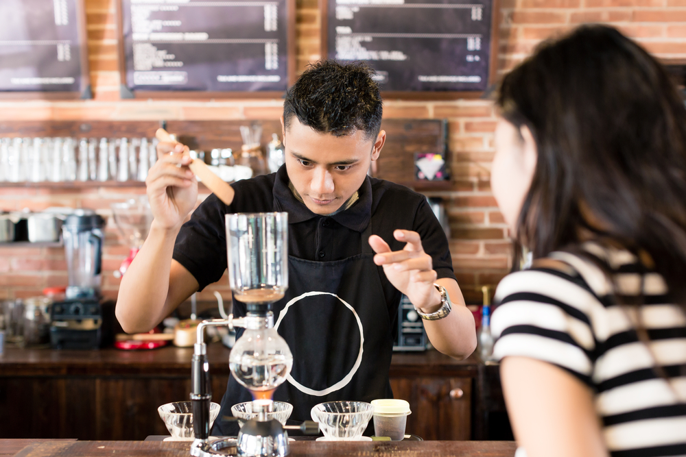 Barista preparing drip coffee