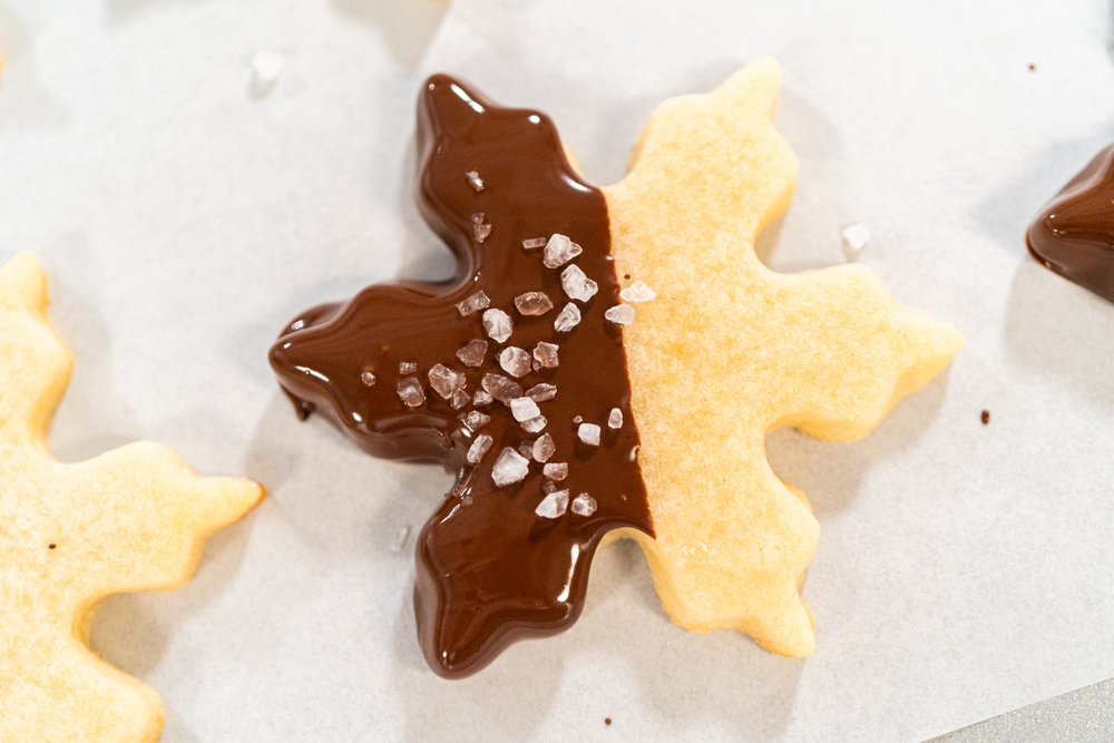 Star-shaped chocolate-dipped cookies with sea salt