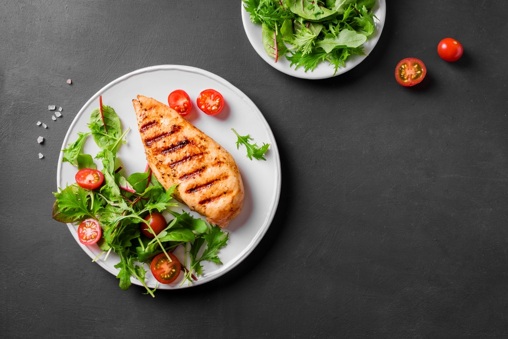 Keto-friendly Grilled chicken breast, fillet, steak and fresh vegetable salad,