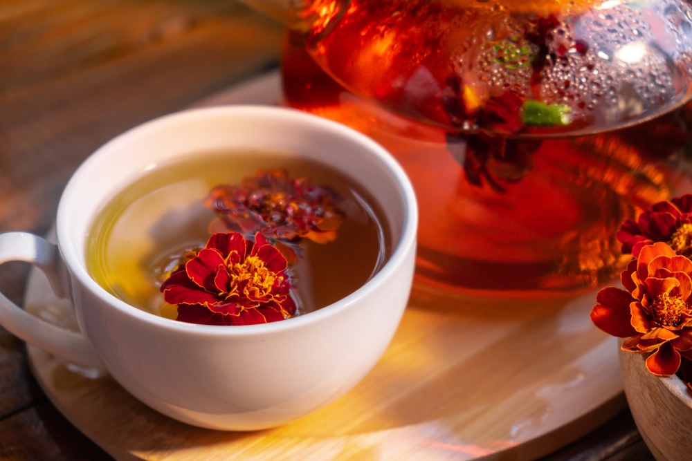 Marigold flower healthy tea in glass mug