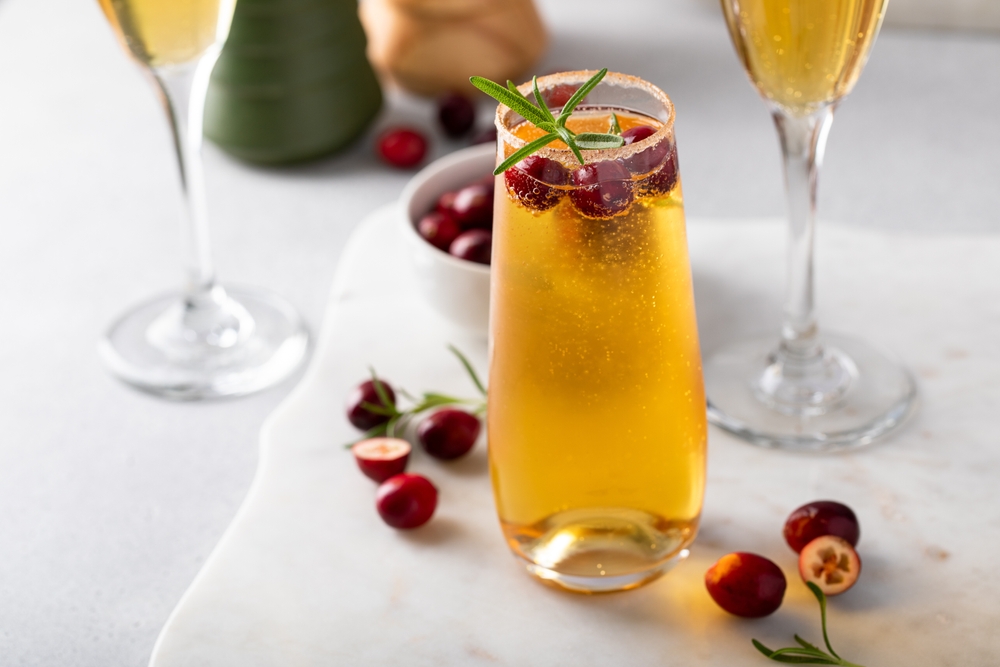 Craft spirits flavors - Apple cider mimosa cocktail with cranberries