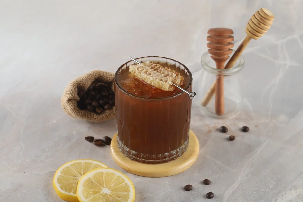 Cold brew coffee with honey and lemon shutterstock 2348475703