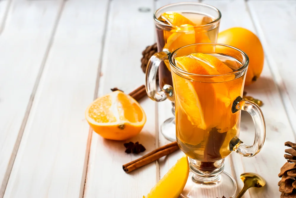 Orange flavored beverage with cinnamon and cardamom shutterstock 343435796
