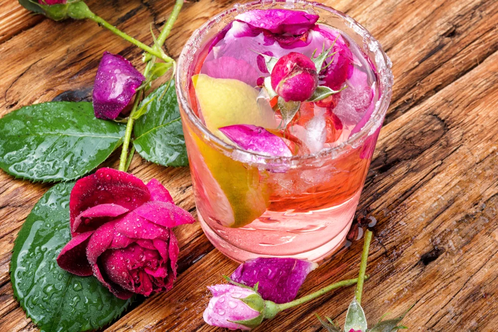 Refreshing drink with rose flowers shutterstock 1412910458