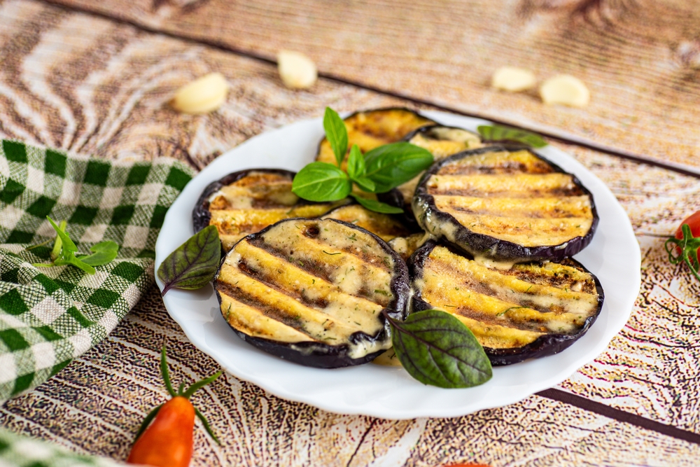 Fried  eggplant with garlic, herbs and cheese
